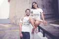 smiling-couple-wearing-t-shirts-mockup-in-an-urban-environment-a20588.png