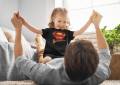 t-shirt-mockup-of-a-little-girl-playing-with-her-dad-at-home-37590-r-el2.png